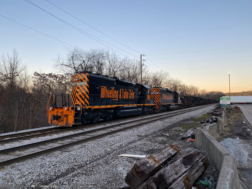 WE 7002 and some 50 empty cars.